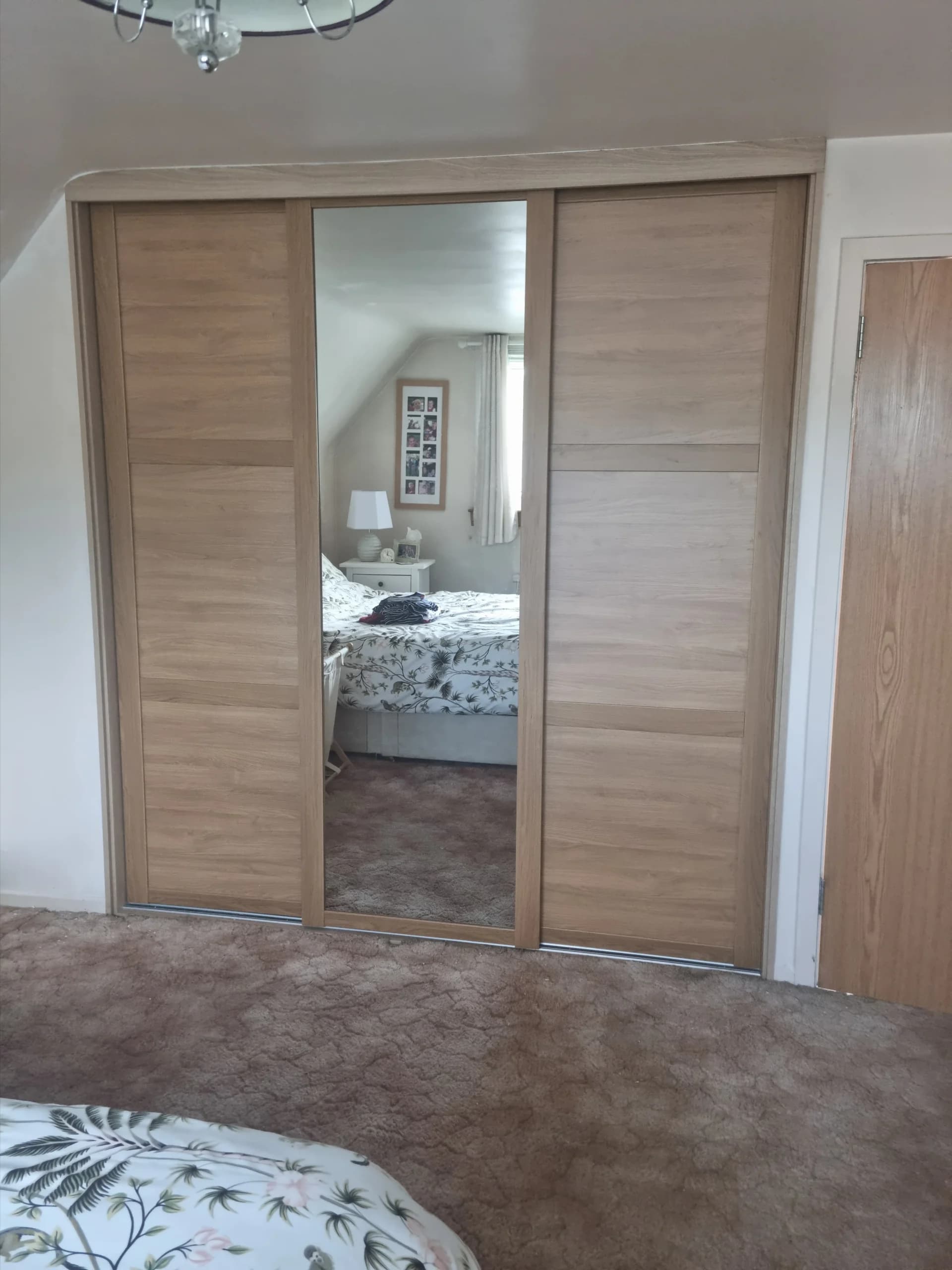 Oak-effect sliding wardrobe doors, part of our fitted wardrobes Musselburgh and East Lothian work