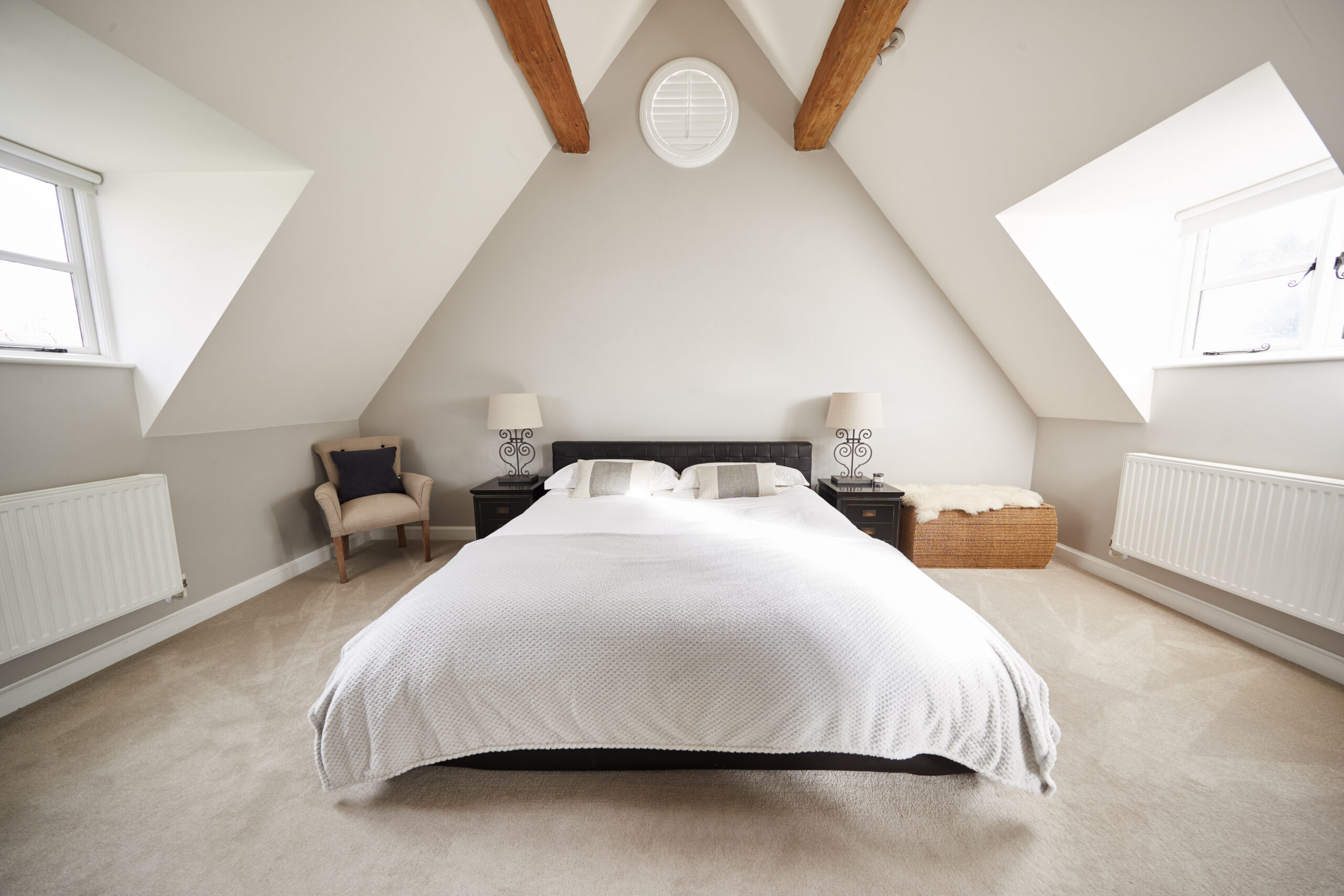 Interior View Of Beautiful Bedroom With Soft Furnishings In Family Home